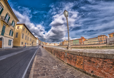 Medieval buildings of Pisa along Arno River - Tuscany, Italy.のeditorial素材