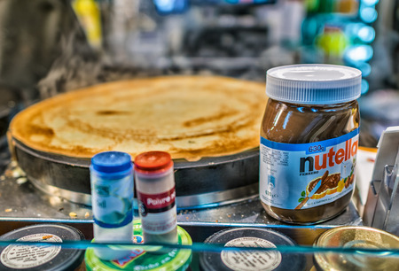 PARIS - JULY 7, 2014: Jar of Nutella on a crepe street seller. Nutella is the brand name of a...