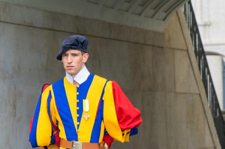 VATICAN CITY, ITALY - MAY 11, 2014: A member of the Pontifical Swiss Guard, Vatican