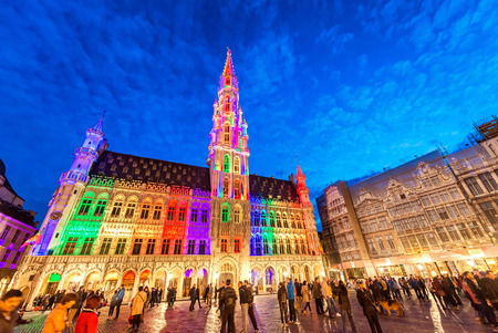 BRUSSELS - MAY 1, 2015: Tourists at night in Grote Marks Square. More than 5 million people visit Brussels annually.のeditorial素材