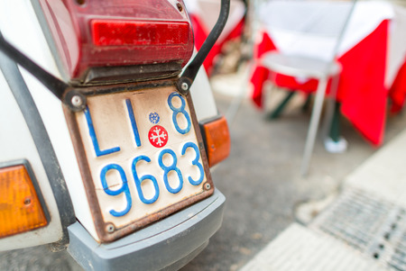 PISA, ITALY - MAY 16, 2015: Old Vespa scooter along city streets. Vespa is an Italian brand of scooter manufactured by Piaggioのeditorial素材