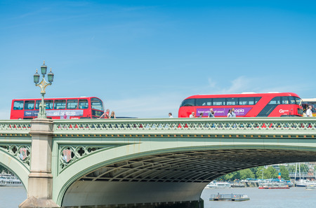 LONDON - JUNE 15, 2015: Traffic and tourists along Westminster Bridge. London attracts 50 million tourists annuallyのeditorial素材