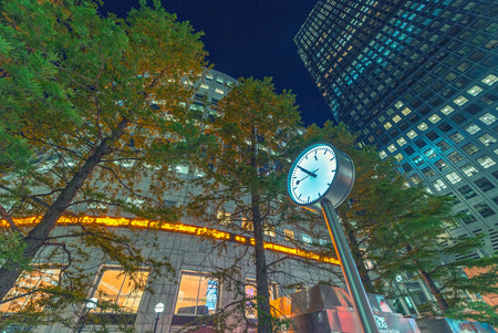 LONDON - JUNE 14, 2015: Lights of Canary Wharf buildings at night. Canary Wharf is the city...