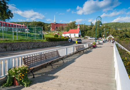 TADOUSSAC, CANADA - JULY 21, 2008: Tourists walk along city streets. Tadoussac is a starting point for whales watching.のeditorial素材
