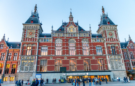 AMSTERDAM - APRIL 25, 2015: People visit Amsterdam Centraal station. Amsterdam attracts 10 million people annually.のeditorial素材