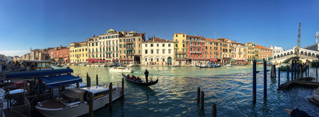VENICE - FEBRUARY 8, 2015: Tourists along city canals. Venice attracts 20 million people annually.のeditorial素材