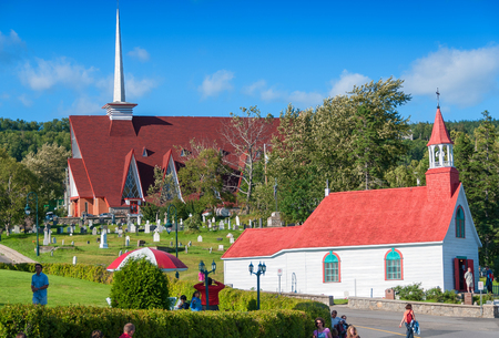 TADOUSSAC, CANADA - JULY 21, 2008: Tourists walk along city streets. Tadoussac is a starting point for whales watching.のeditorial素材