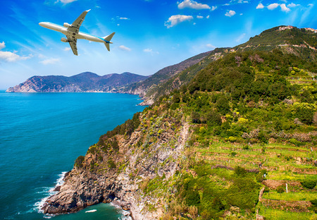 Airplane overflying beautiful coastline.のeditorial素材