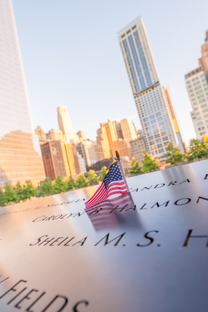 NEW YORK CITY - JUNE 12, 2013: NYC's 9/11 Memorial at World Trade Center Ground Zero seen on June 12, 2013. The memorial was dedicated on the 10th anniversary of the Sept. 11, 2001 attacks.のeditorial素材