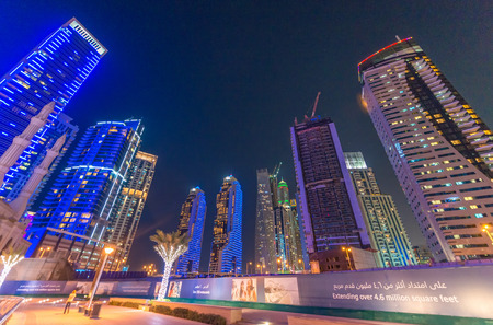 DUBAI, UAE - OCTOBER 9, 2015: Dubai Marina night skyline. The city attracts 13 million people wordwide every year.のeditorial素材