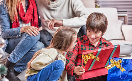 Happy family at home for Christmas holidays.の写真素材