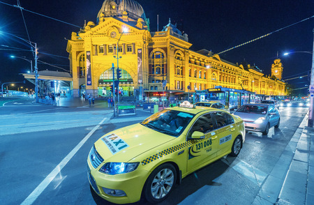MELBOURNE AUSTRALIA - OCTOBER 10, 2015: Taxi in Melbourne downtown. Taxi is a key part of public transportation system in Melbourneのeditorial素材