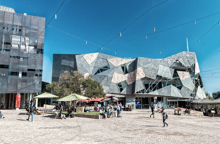 MELBOURNE, AUSTRALIA - OCTOBER 10, 2015: Iconic Federation Square on a dpring day. It is a mixed-use development in the inner city of Melbourne, covering an area of 3.2 hectares.のeditorial素材