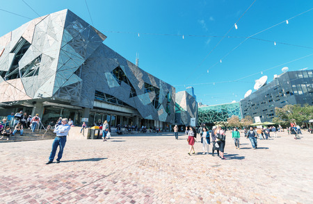 MELBOURNE, AUSTRALIA - OCTOBER 10, 2015: Iconic Federation Square on a dpring day. It is a mixed-use development in the inner city of Melbourne, covering an area of 3.2 hectares.のeditorial素材