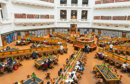MELBOURNE - OCTOBER 9, 2015: La Trobe reading room at the State Library of Victoria in Melbourne. The library holds over 2 million books. It is the central library of the state of Victoria, Australiaのeditorial素材
