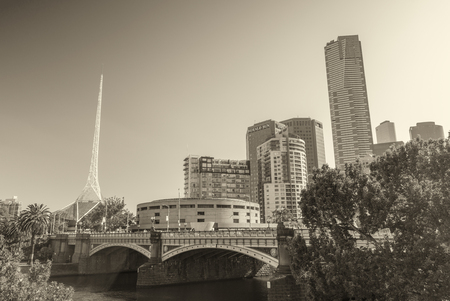 MELBOURNE - OCTOBER 17, 2015: Black and white view of city skyline. Melbourne attracts more than 5 million people worldwide annually.のeditorial素材