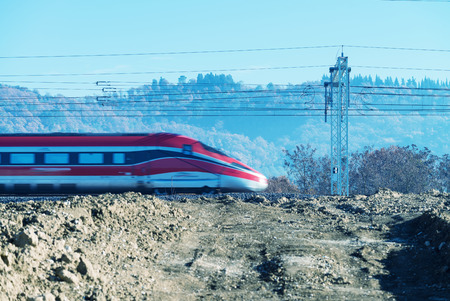 Fast speeding up train in countryside railway.の写真素材
