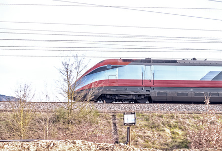 Fast moving train on a cloudy day. Industrial concept.