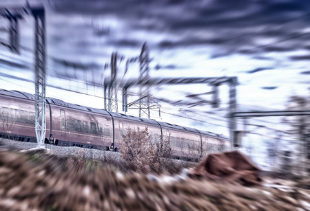 Fast moving train on a cloudy day. Industrial concept.