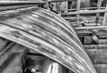 Cold rolled steel coil on decoiler of machine in metalwork manufacturing.の写真素材