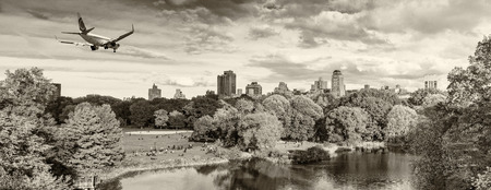 Airplane over Central Park in New York City. Travel concept.