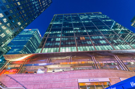 LONDON - JUNE 29, 2015: Buildings of Canary Wharf at night. Canary Wharf is London business...