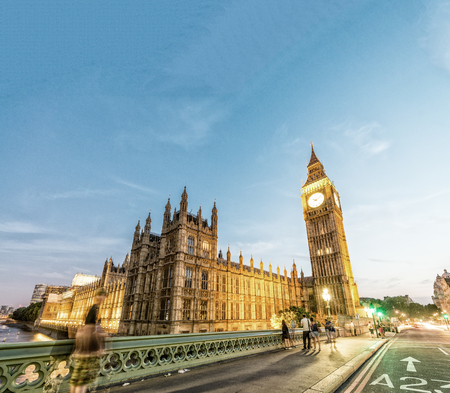 Westminster Palace at night with city traffic, London - UK.