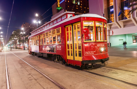 NEW ORLEANS - FEB 11: People travel with the Street car in Canal street at night on February 11, 2016 in New Orleans, USA. It is the oldest continually operating street car line in the world.のeditorial素材
