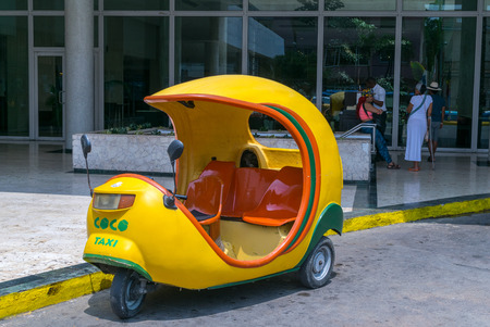 HAVANA - APRIL 6, 2016: Cocotaxi is an auto rickshaw type taxi vehicle in Cuba and a cheap way to go from one point to the other in Havana.のeditorial素材