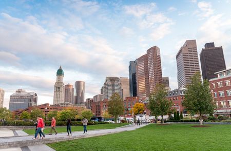 BOSTON - OCTOBER 18, 2015: Tourists walk along city park. Boston attracts 10 million people annually.のeditorial素材