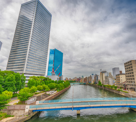 Osaka skyscrapers over the river.の写真素材