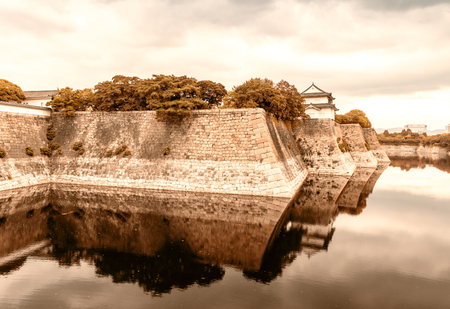 Walls of Osaka Castle with water reflections.のeditorial素材