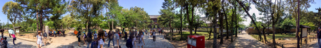 NARA, JAPAN - MAY 2016: Panoramic view of city park with tourists. Nara is a famous tourist...