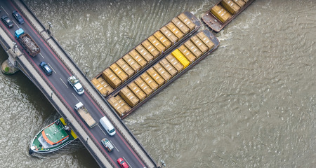 Cargo ship crossing Thames river.の写真素材