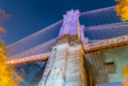Blurred view of Brooklyn Bridge Tower at night, New York City.の写真素材