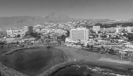 TENERIFE, SPAIN - SEPTEMBER 7, 2016: Panoramic aerial view of Playa de las Americas buildings. Tenerife attracts 5 million people annually.のeditorial素材