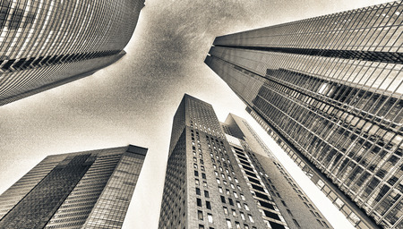 Skyscrapers at night. Skyward view from street. Business and corporate concept.の写真素材