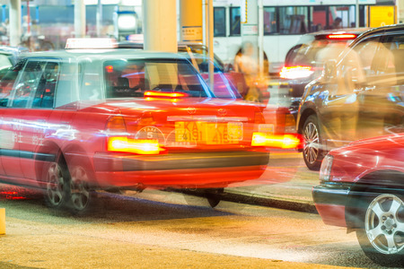 HONG KONG - APRIL 2014: Taxis on the street on April 2014 in Hong Kong. Over 90% daily travelers use public transport. Its the highest rank in the world.のeditorial素材