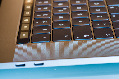 PISA, ITALY - DECEMBER 13, 2016: New Apple Macbook Pro with touchbar. It sets a new standard in laptop sector.のeditorial素材