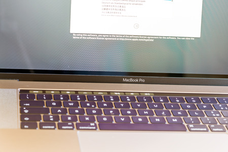 PISA, ITALY - DECEMBER 13, 2016: New Apple Macbook Pro with touchbar. It sets a new standard in...