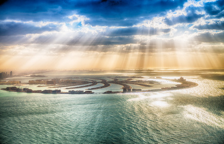 Dubai Palm Jumeirah Island with sun says.