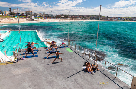 BONDI BEACH, AUSTRALIA - OCTOBER 2015: People relax on the beach on a beautiful day. Bondi Beach is a famous place in Sydney.のeditorial素材