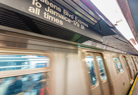 NEW YORK CITY - OCTOBER 24, 2015: Fast moving train in subway station. Subway is the fastest way to move across the city.のeditorial素材