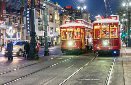 NEW ORLEANS, USA - FEBRUARY 11. 2016: Blurred view of New Orleans Streetcar Line in downtown at night. The New Orleans Streetcar line began electric operation in 1893.のeditorial素材