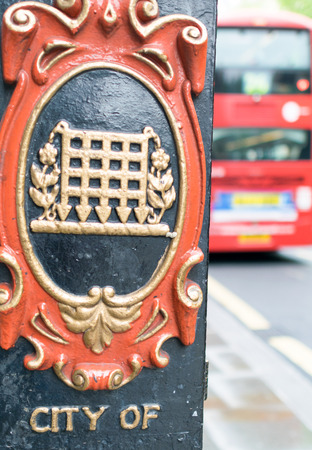 City of Westminster sign in London with red bus on background.のeditorial素材
