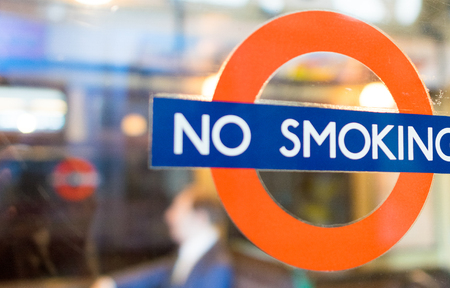 LONDON - JULY 2, 2015: No Smoking sign in the city. It is illegal to smoke in all enclosed work places in England.のeditorial素材