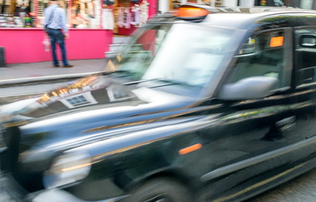 Fast moving blurred taxi in London.のeditorial素材