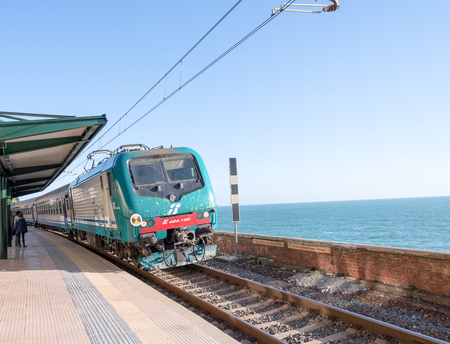 CINQUE TERRE, ITALY - APRIL 7, 2013: Train along italian coast. The train is the best way to visit all Five Lands.のeditorial素材