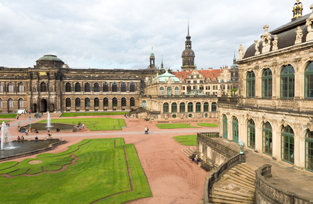 DRESDEN, GERMANY - JULY 2016: Dresdner Zwinger palace is designed by Poeppelmann in 1710 as orangery and exhibition gallery. Tourists walk and visit the beautiful palace in a cloudy day.のeditorial素材