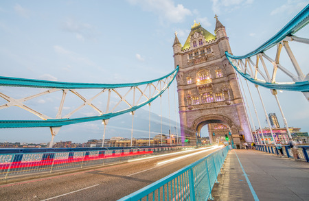 LONDON - JUNE 2015: The Tower Bridge after sunset. London attracts 30 million tourists annually.